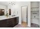 This bathroom features modern lighting, a vanity, and open shelving at 5610 Farmbrook Dr, Charlotte, NC 28210
