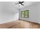 Bright, empty bedroom with beautiful hardwood floors and natural light at 5610 Farmbrook Dr, Charlotte, NC 28210