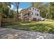 Stunning two-story home boasting modern architecture, a pristine lawn, and a secure black fence at 5610 Farmbrook Dr, Charlotte, NC 28210