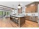 Open kitchen featuring a large island with seating and modern appliances at 5610 Farmbrook Dr, Charlotte, NC 28210