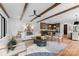 Open-concept living room connected to the kitchen, featuring hardwood floors and stylish furnishings at 5610 Farmbrook Dr, Charlotte, NC 28210