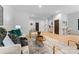 Open living room featuring wood floors, modern furnishings and decor at 5610 Farmbrook Dr, Charlotte, NC 28210