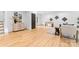 Spacious living room featuring wood floors, foosball table and modern decor at 5610 Farmbrook Dr, Charlotte, NC 28210