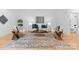 Bright living room featuring wood floors, modern furnishings and decor at 5610 Farmbrook Dr, Charlotte, NC 28210