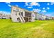 Expansive backyard featuring a large lawn, covered porch, and convenient stair access at 6022 Candlestick Ln, Lancaster, SC 29720