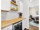 Charming bar area with wood countertops, mini fridge, and ample cabinet space at 6022 Candlestick Ln, Lancaster, SC 29720