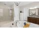 Luxurious bathroom featuring a glass shower, soaking tub, and granite countertops at 6022 Candlestick Ln, Lancaster, SC 29720