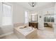 Relaxing bathroom featuring a soaking tub, marble countertops, and neutral color palette at 6022 Candlestick Ln, Lancaster, SC 29720