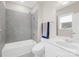 Bathroom features a white shower tub and a sink vanity with gray backsplash at 6022 Candlestick Ln, Lancaster, SC 29720