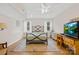 Bedroom with hardwood floors featuring a queen bed, dresser, and a TV at 6022 Candlestick Ln, Lancaster, SC 29720