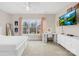 Bright bedroom features a ceiling fan, large windows, and an adjacent white vanity desk at 6022 Candlestick Ln, Lancaster, SC 29720