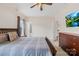 Cozy bedroom featuring string lights, a ceiling fan, and a decorative headboard at 6022 Candlestick Ln, Lancaster, SC 29720