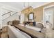 Elegant dining room with decorative lighting and a spacious table setting, adjacent to the foyer and staircase at 6022 Candlestick Ln, Lancaster, SC 29720
