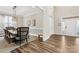 Open dining room with hardwood floors, an elegant chandelier, and access to the foyer and entryway at 6022 Candlestick Ln, Lancaster, SC 29720