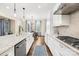 Bright kitchen boasting stainless steel appliances, marble countertops, and eat-in dining area at 6022 Candlestick Ln, Lancaster, SC 29720