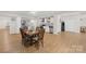 Open kitchen and dining area features stainless steel appliances and hardwood floors at 6022 Candlestick Ln, Lancaster, SC 29720