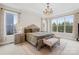 Serene main bedroom with a decorative chandelier, large windows, and stylish furnishings at 6022 Candlestick Ln, Lancaster, SC 29720