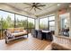 Inviting screened-in sunroom with comfortable seating and dining area, perfect for enjoying the outdoors at 6022 Candlestick Ln, Lancaster, SC 29720