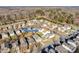 An aerial view of a residential neighborhood showcases the property's location with mature trees at 6523 Matlea Ct, Charlotte, NC 28215
