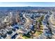 An elevated view of a neighborhood with tightly packed residences near a wooded area and lake at 6523 Matlea Ct, Charlotte, NC 28215