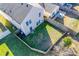 Aerial view of a fenced backyard, small patio, and a well maintained lawn at 6523 Matlea Ct, Charlotte, NC 28215