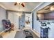 Functional bedroom with a wall-mounted TV, gaming console, and office chair at 6523 Matlea Ct, Charlotte, NC 28215
