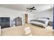 This bedroom features neutral walls, a ceiling fan, and abundant natural light, creating a serene and inviting space at 6523 Matlea Ct, Charlotte, NC 28215