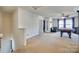 Bright bonus room with a pool table, neutral carpet, and natural light, perfect for entertainment and relaxation at 6523 Matlea Ct, Charlotte, NC 28215