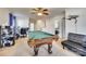 Versatile bonus room with a pool table, desk area, and comfortable seating, perfect for entertaining and relaxing at 6523 Matlea Ct, Charlotte, NC 28215