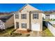 Charming two-story home with a single car garage, complemented by black shutters and well-kept landscaping at 6523 Matlea Ct, Charlotte, NC 28215