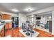 Open kitchen with modern black appliances, a breakfast bar, and seamless flow to living areas at 6523 Matlea Ct, Charlotte, NC 28215