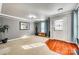 Inviting living room showcasing hardwood accents, neutral tones, and ample natural light at 6523 Matlea Ct, Charlotte, NC 28215