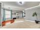 Bright living room with hardwood floors, large windows with blue curtains, and elegant decor at 6523 Matlea Ct, Charlotte, NC 28215