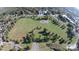 An aerial view displays a large grassy area with trees and a playground at 705 Drew Ave, Fort Mill, SC 29708