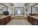 Bathroom featuring a large soaking tub, dual vanities and tile flooring at 705 Drew Ave, Fort Mill, SC 29708