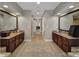 Hallway into a full bathroom featuring dual vanities, tile flooring and granite counters at 705 Drew Ave, Fort Mill, SC 29708