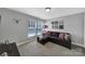 Comfortable bedroom featuring plush carpet, a window with blinds and a cozy dark colored couch at 705 Drew Ave, Fort Mill, SC 29708