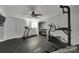 Home gym with modern equipment, rubber flooring, and a ceiling fan for a great workout experience at 705 Drew Ave, Fort Mill, SC 29708