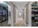 Hallway leading to large walk-in closet, soaking tub and second closet with shelves at 705 Drew Ave, Fort Mill, SC 29708