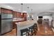Open concept kitchen with a large island, stainless steel appliances, and hardwood floors at 705 Drew Ave, Fort Mill, SC 29708