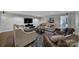 Stylish living room with modern decor, plush seating, and a large television at 705 Drew Ave, Fort Mill, SC 29708