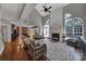 Spacious living room boasts a fireplace, high ceilings, and an open floor plan to the kitchen at 705 Drew Ave, Fort Mill, SC 29708