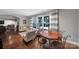 Cozy living room featuring large windows, hardwood floors, modern furniture and striped curtains at 705 Drew Ave, Fort Mill, SC 29708