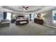 Large primary bedroom with tray ceilings, ample natural light, and a serene ambiance at 705 Drew Ave, Fort Mill, SC 29708
