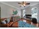 Well-lit office space features hardwood flooring, ample natural light, and comfortable leather seating at 705 Drew Ave, Fort Mill, SC 29708