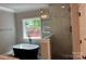 Bathroom showcasing a standalone tub, marble tile shower and natural light at 7221 Static Way # 13, Sherrills Ford, NC 28673