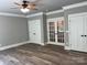 Bedroom featuring two closets, neutral paint, hardwood floors and ceiling fan and exterior access at 7221 Static Way # 13, Sherrills Ford, NC 28673