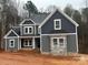 Newly constructed two-story home featuring gray siding, white trim, and stone accents on the facade at 7221 Static Way # 13, Sherrills Ford, NC 28673