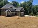 Charming two-story home with a large yard and a modern gray color scheme at 7221 Static Way # 13, Sherrills Ford, NC 28673