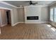 Spacious living room, neutral paint, modern fireplace and hardwood floors at 7221 Static Way # 13, Sherrills Ford, NC 28673